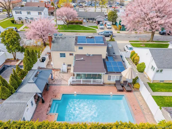 an aerial view of a house with swimming pool