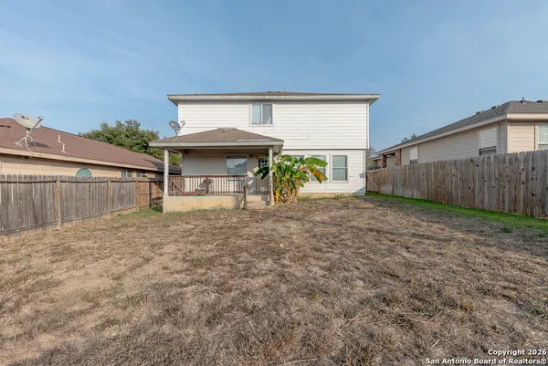 a view of a house with backyard and a slide