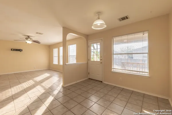 a view of an empty room with a window