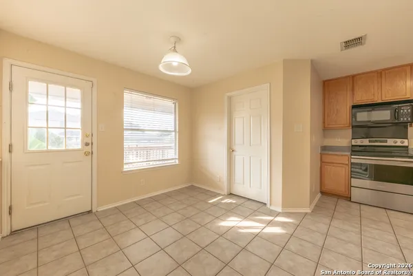a view of a kitchen and window
