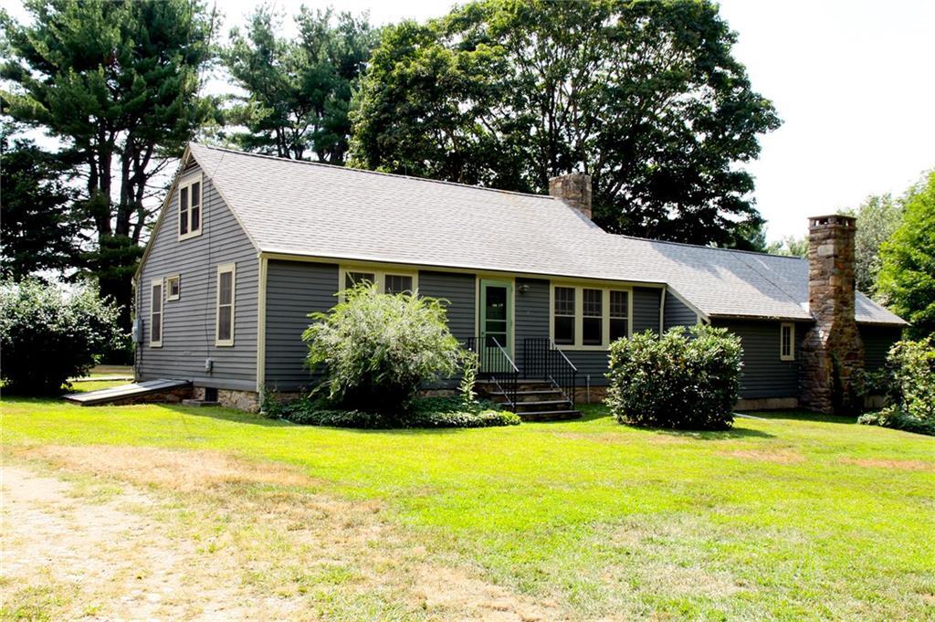 a view of a house with swimming pool and garden