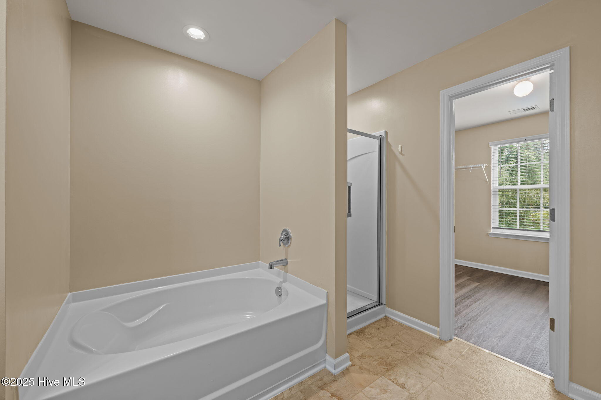 305 Frida Road New Bern, NC 28560 - Photo 35 of 53 Primary bathroom has a soaking tub and walkin shower