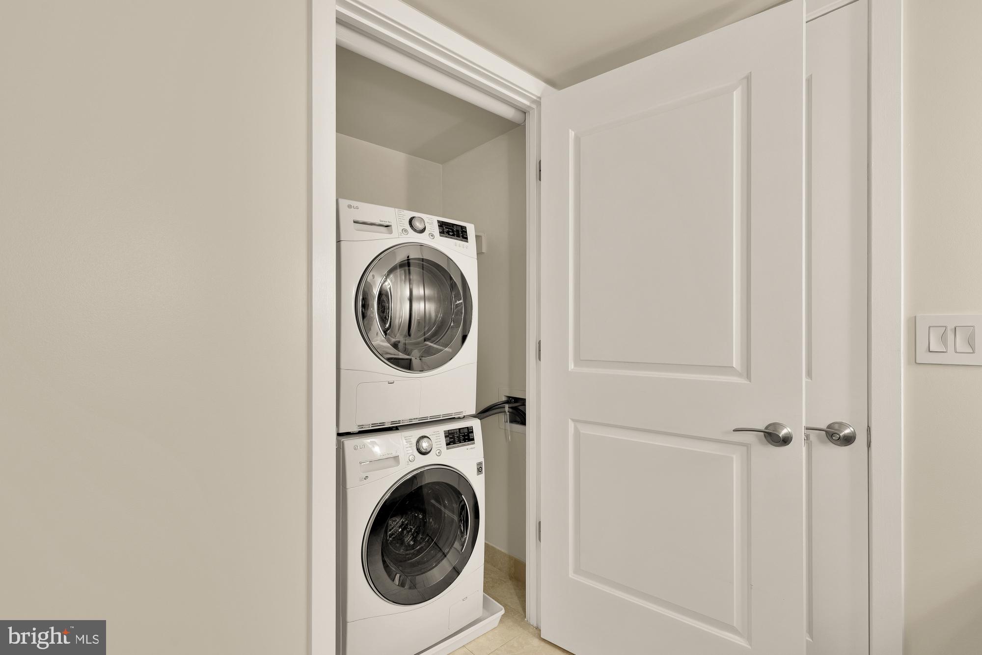 1025 First Street Southeast, Unit 510 Washington, DC 20003 - Photo 16 of 25 LG washer/dryer located in the primary suite.