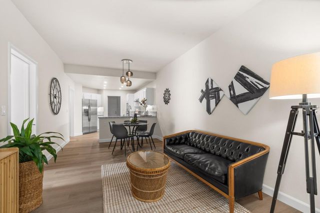 a bedroom with a bed and a chair