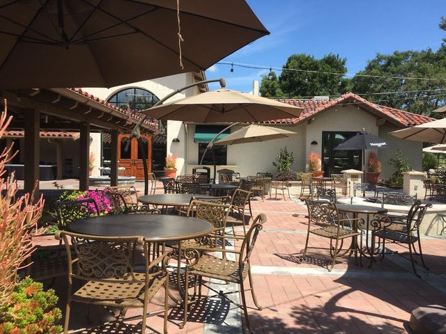 a view of a building with sitting area