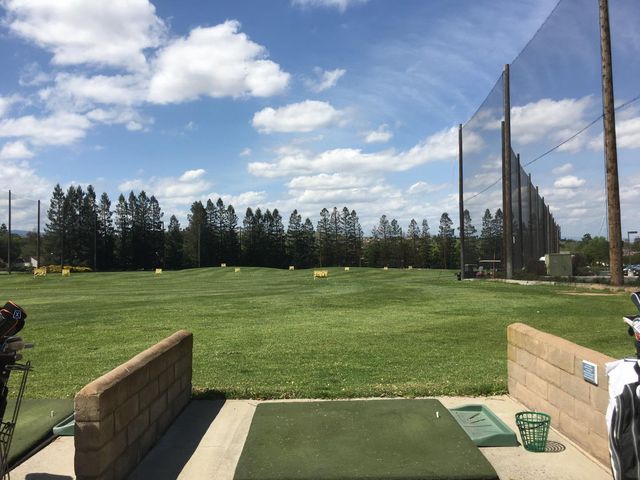 a view of a golf course with a lake