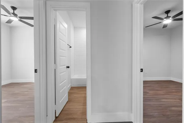 a view of a bathroom from the hallway