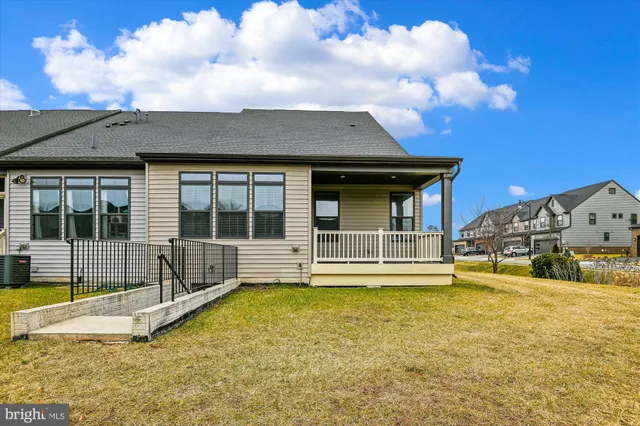 a view of a house with swimming pool and porch