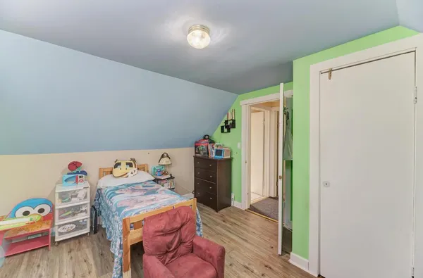 a bed room with a bed and a window