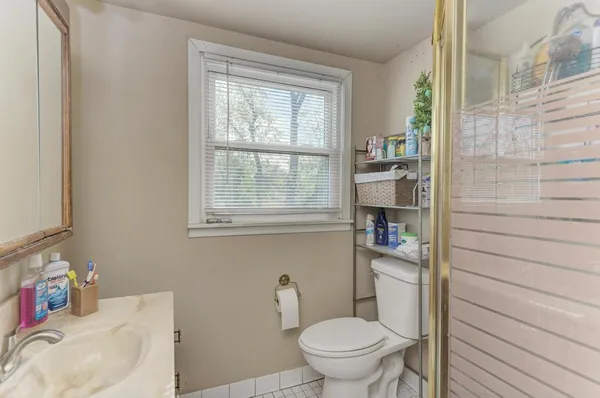 a bathroom with a toilet and a sink