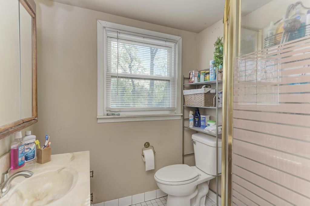 1431 North Hillside Avenue Berkeley, IL 60163 - Photo 18 of 29 a bathroom with a toilet and a sink