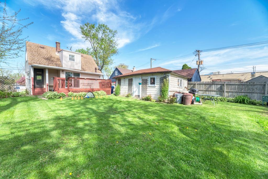 1431 North Hillside Avenue Berkeley, IL 60163 - Photo 25 of 29 a front view of a house with a yard