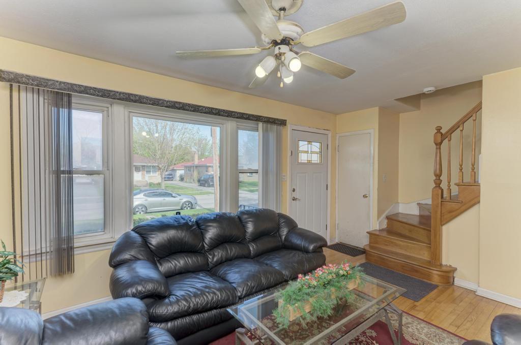 1431 North Hillside Avenue Berkeley, IL 60163 - Photo 4 of 29 a living room with furniture and a large window
