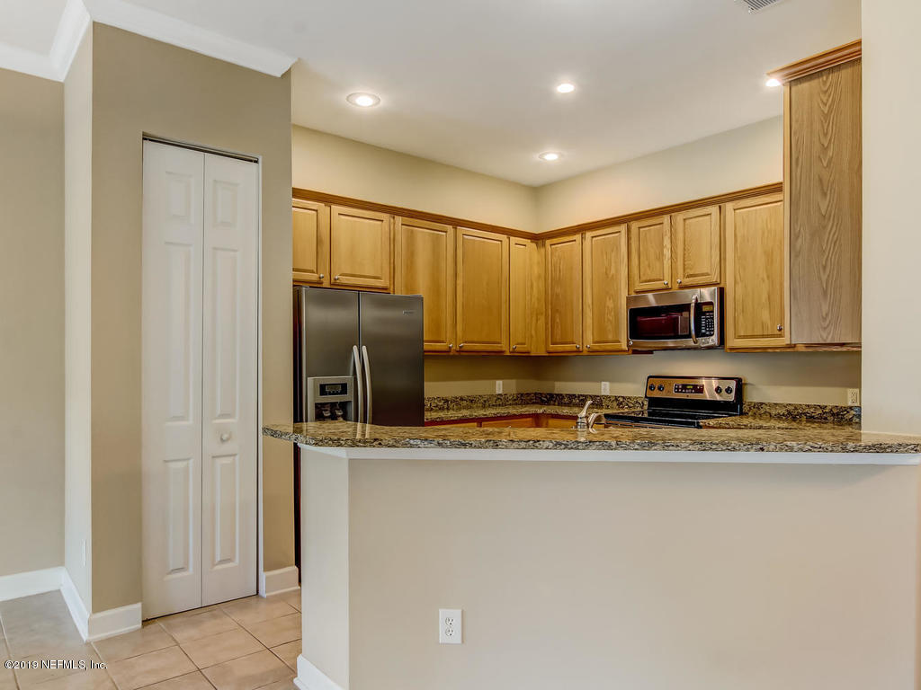 2014 Pond Ridge Court, Unit 1106 Fleming Island, FL 32003 - Photo 15 of 84 To Kitchen
