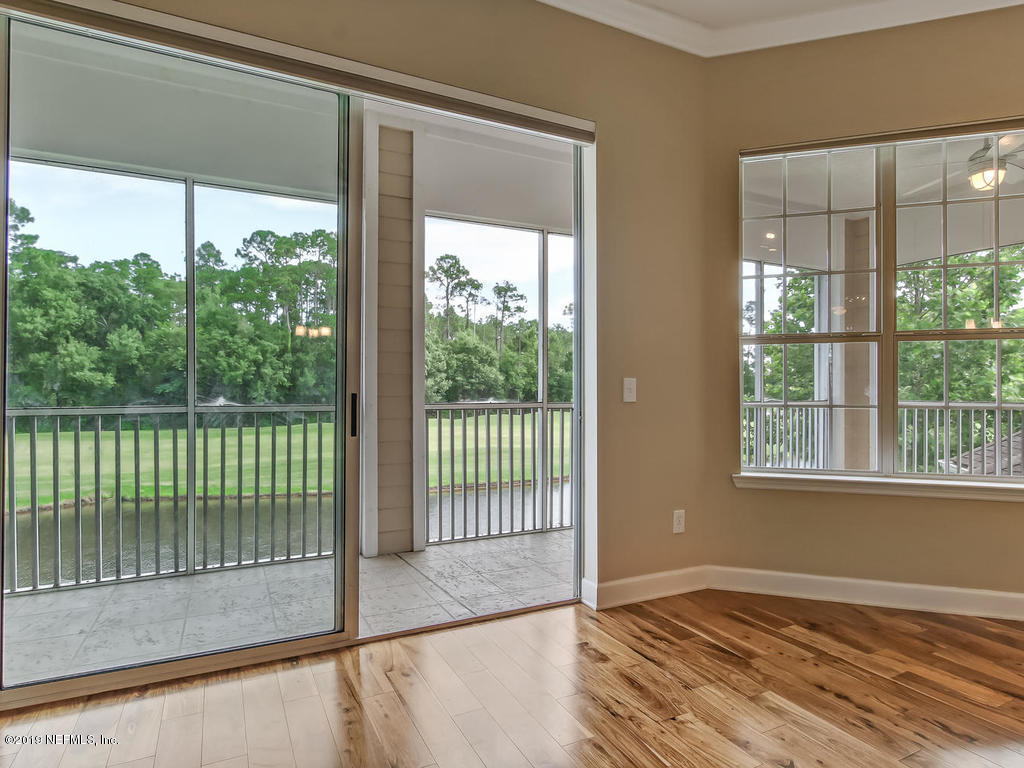 2014 Pond Ridge Court, Unit 1106 Fleming Island, FL 32003 - Photo 29 of 84 To Screened Balcony