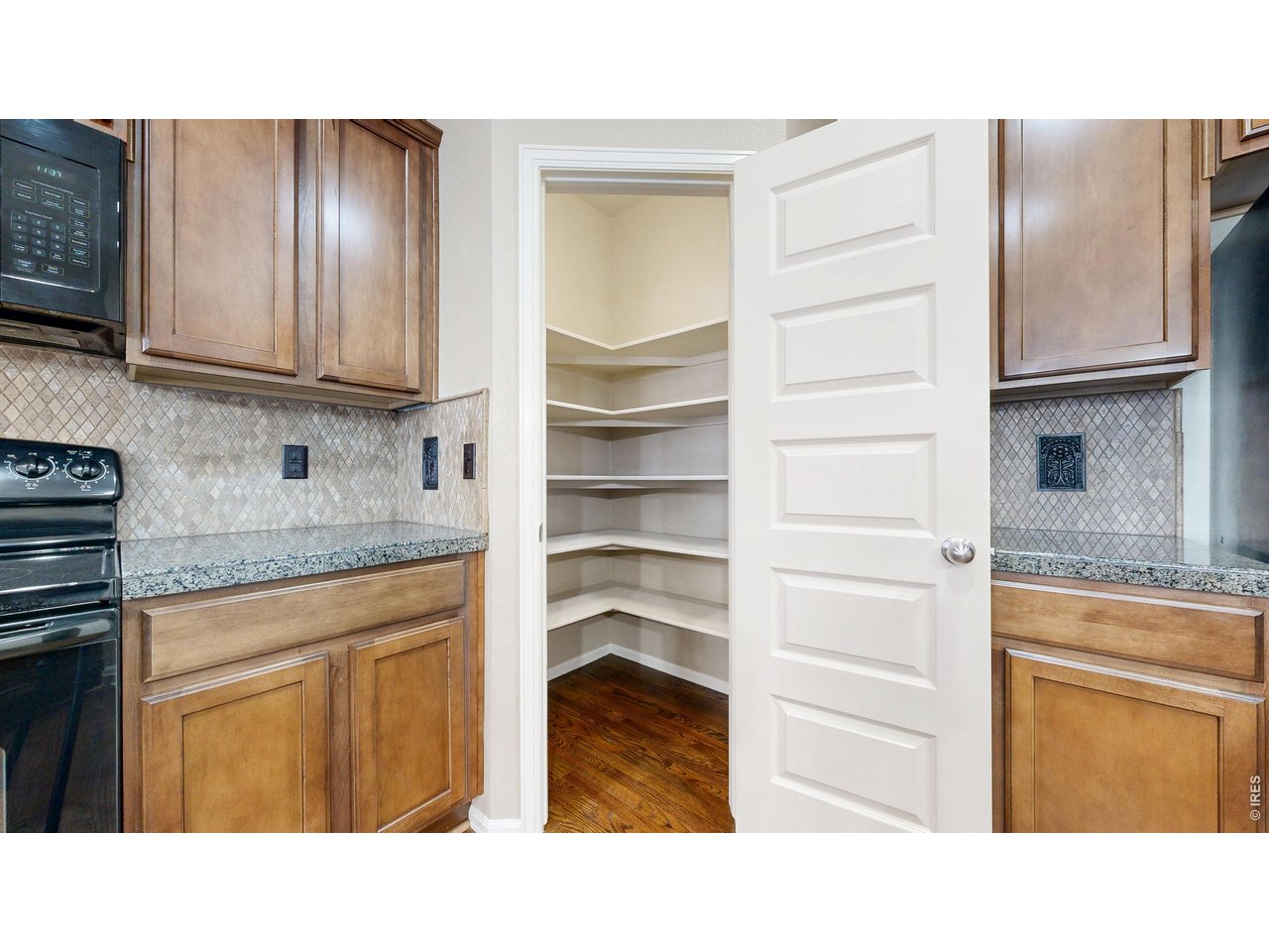 5543 Calgary Street Timnath, CO 80547 - Photo 9 of 39 Spacious Kitchen Pantry!