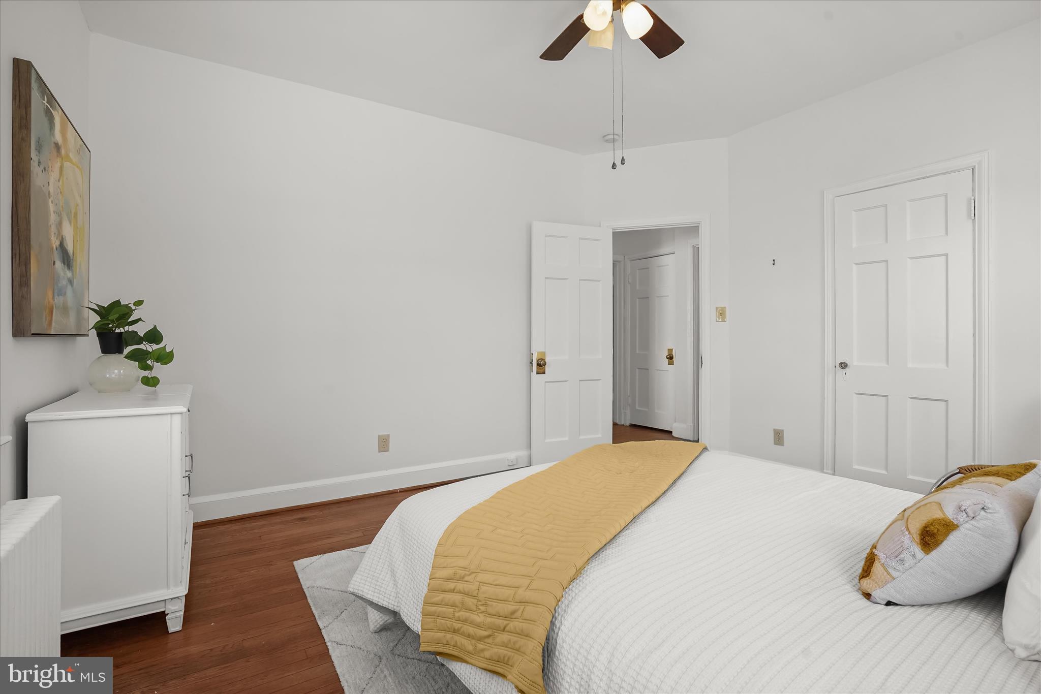 6601 7th Street Northwest Washington, DC 20012 - Photo 17 of 52 a bedroom with a bed and a chandelier
