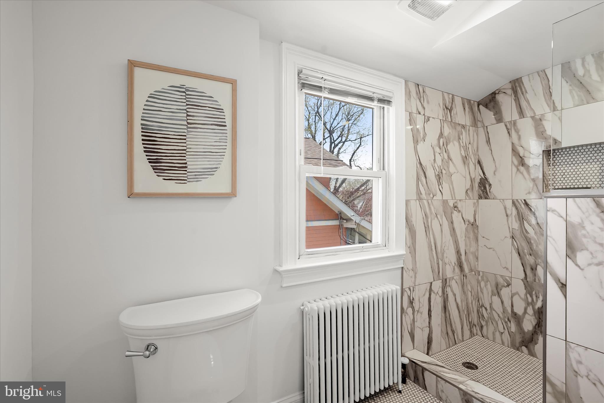 6601 7th Street Northwest Washington, DC 20012 - Photo 25 of 52 a bathroom with a toilet and a shower curtain