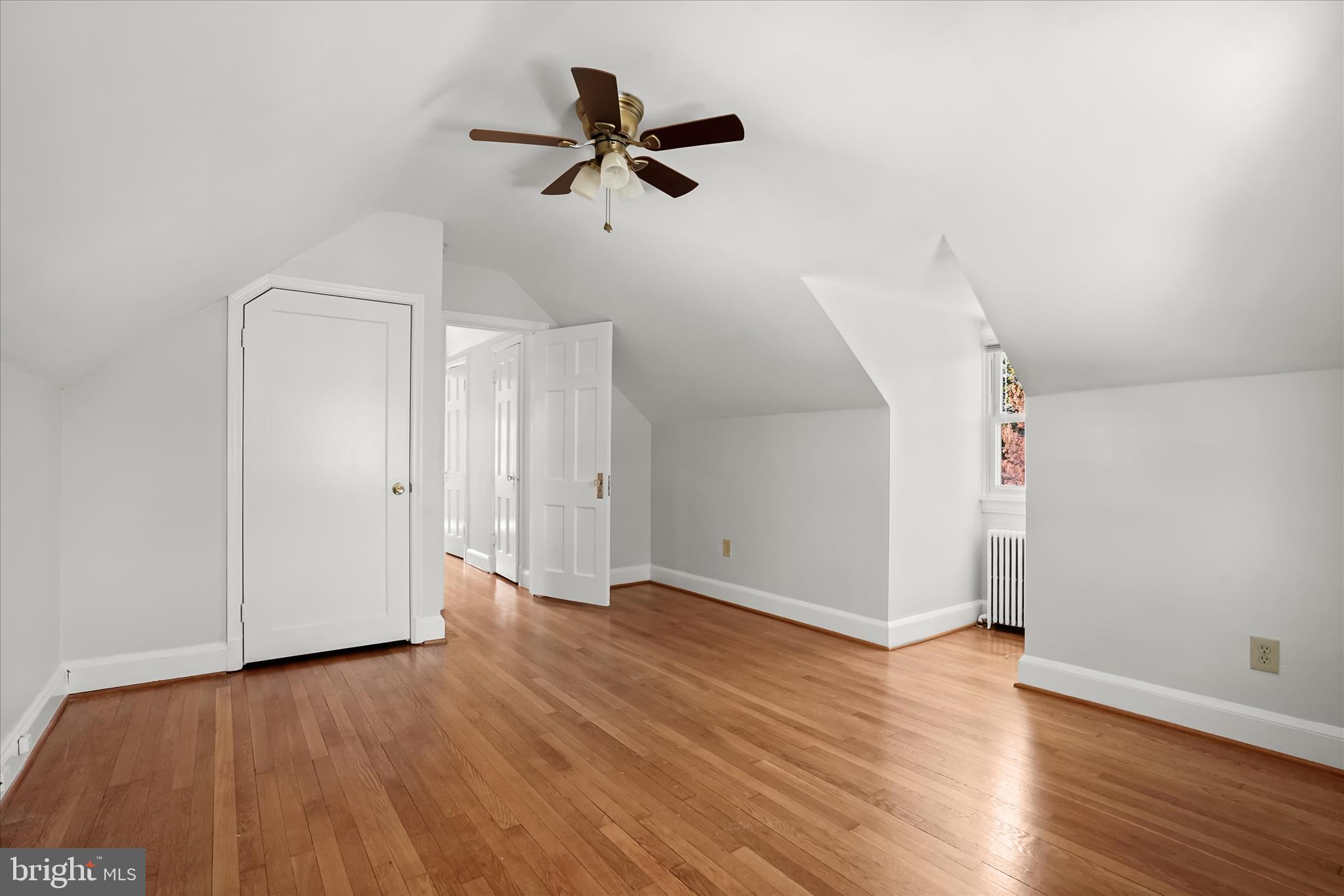 6601 7th Street Northwest Washington, DC 20012 - Photo 27 of 52 an empty room with wooden floor and a ceiling fan