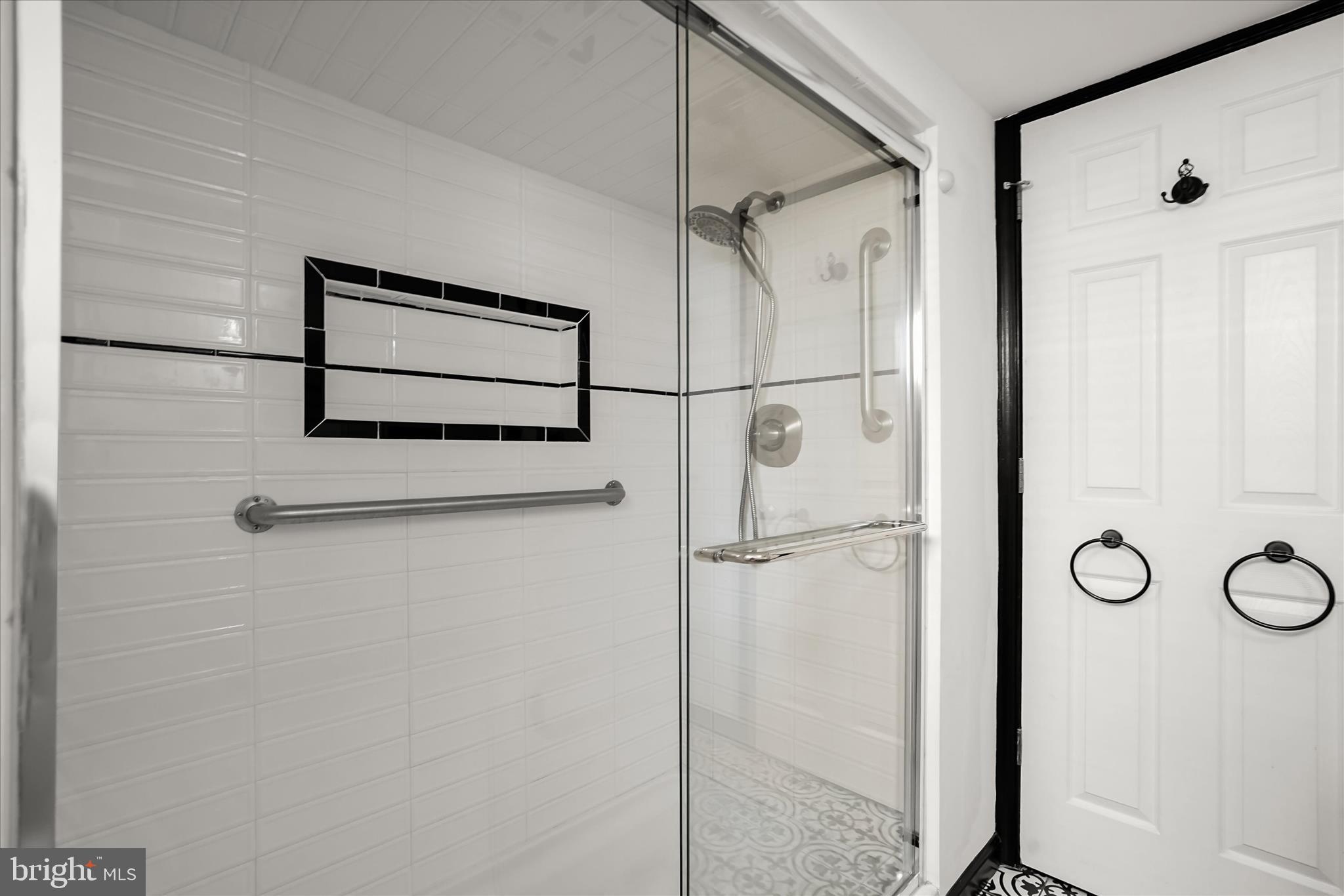 6601 7th Street Northwest Washington, DC 20012 - Photo 38 of 52 a bathroom with a shower and a glass door