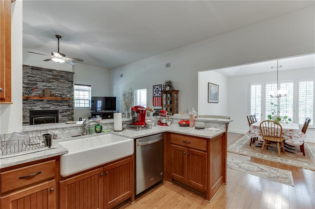 7660 Fern Lane Lula, GA 30554 - Photo 14 of 50 a kitchen with a sink stove and cabinets