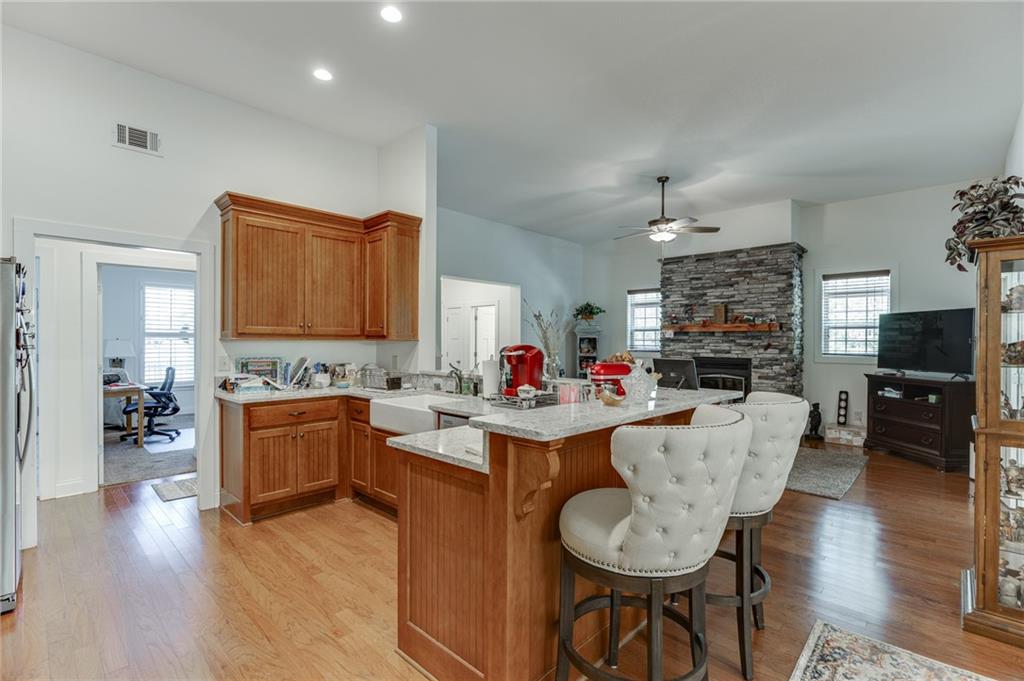 7660 Fern Lane Lula, GA 30554 - Photo 15 of 50 a living room with fireplace furniture and a flat screen tv