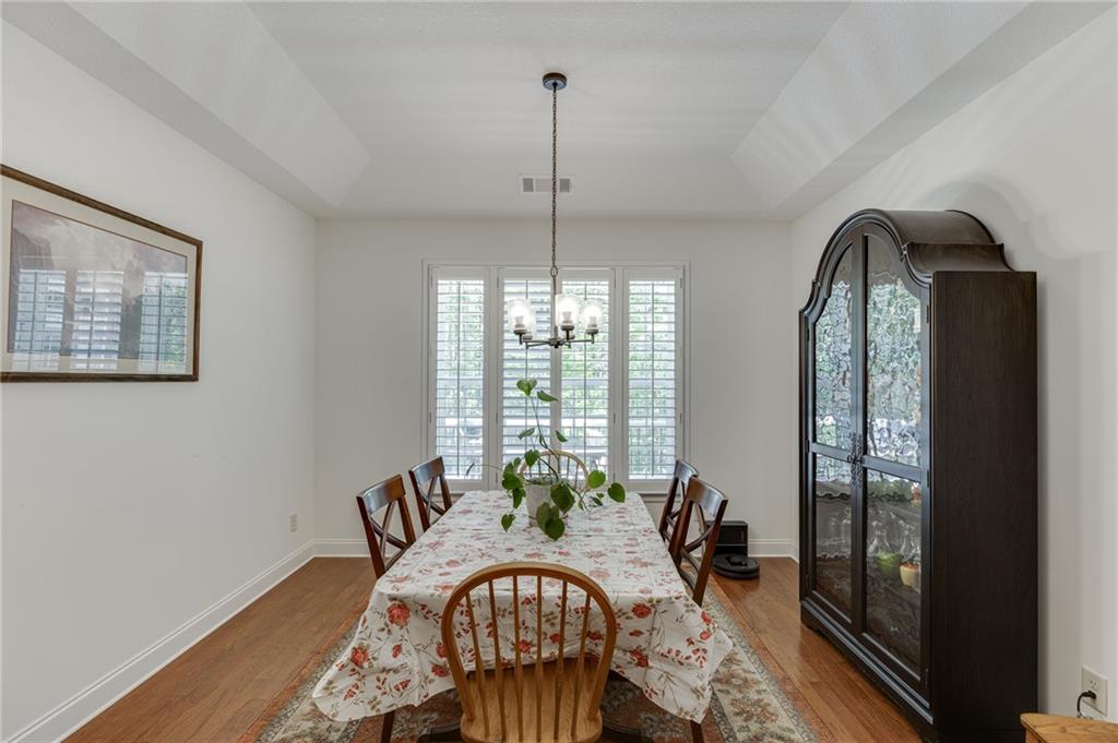 7660 Fern Lane Lula, GA 30554 - Photo 18 of 50 a view of a dining room with furniture window and wooden floor