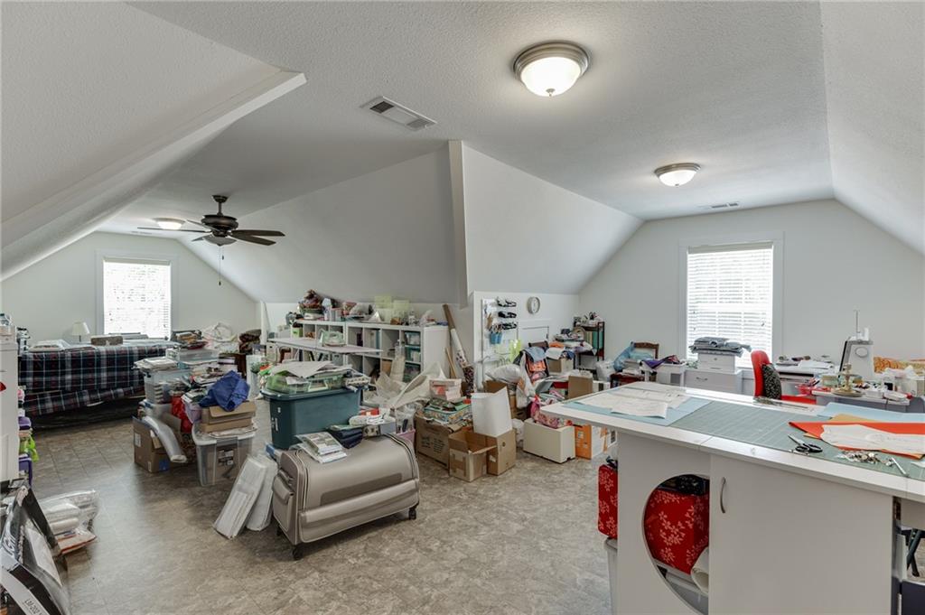 7660 Fern Lane Lula, GA 30554 - Photo 33 of 50 a living room with furniture a air conditioner vent and a window