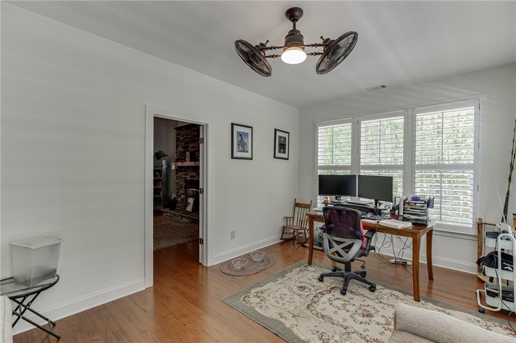 7660 Fern Lane Lula, GA 30554 - Photo 37 of 50 a workspace with wooden floor