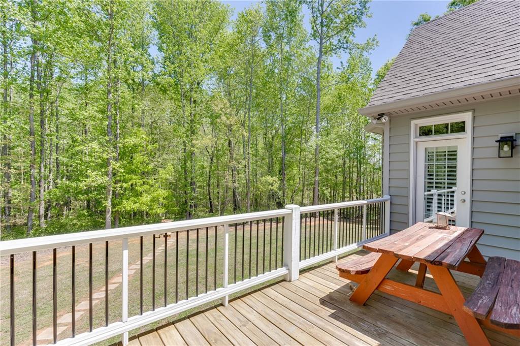7660 Fern Lane Lula, GA 30554 - Photo 39 of 50 a view of balcony with wooden floor and outdoor seating