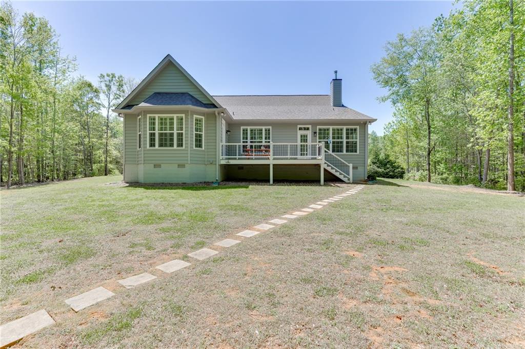 7660 Fern Lane Lula, GA 30554 - Photo 42 of 50 a front view of a house with a yard