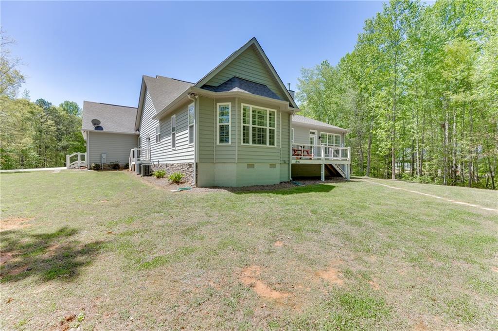 7660 Fern Lane Lula, GA 30554 - Photo 43 of 50 a front view of a house with a yard