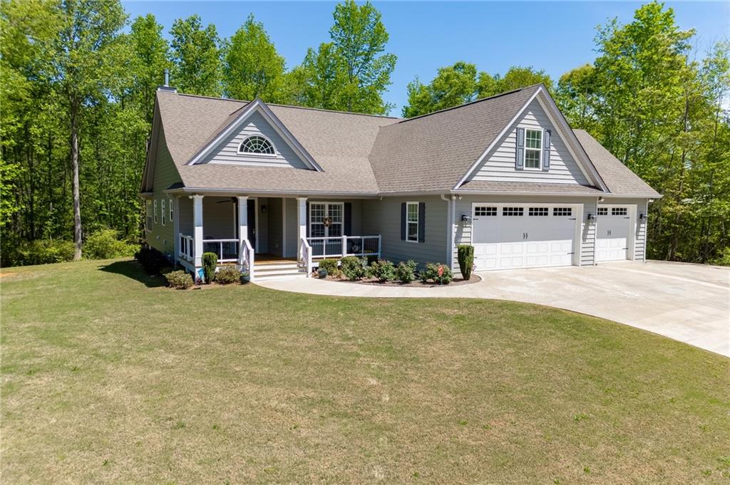 7660 Fern Lane Lula, GA 30554 - Photo 47 of 50 a front view of house with yard patio and green space