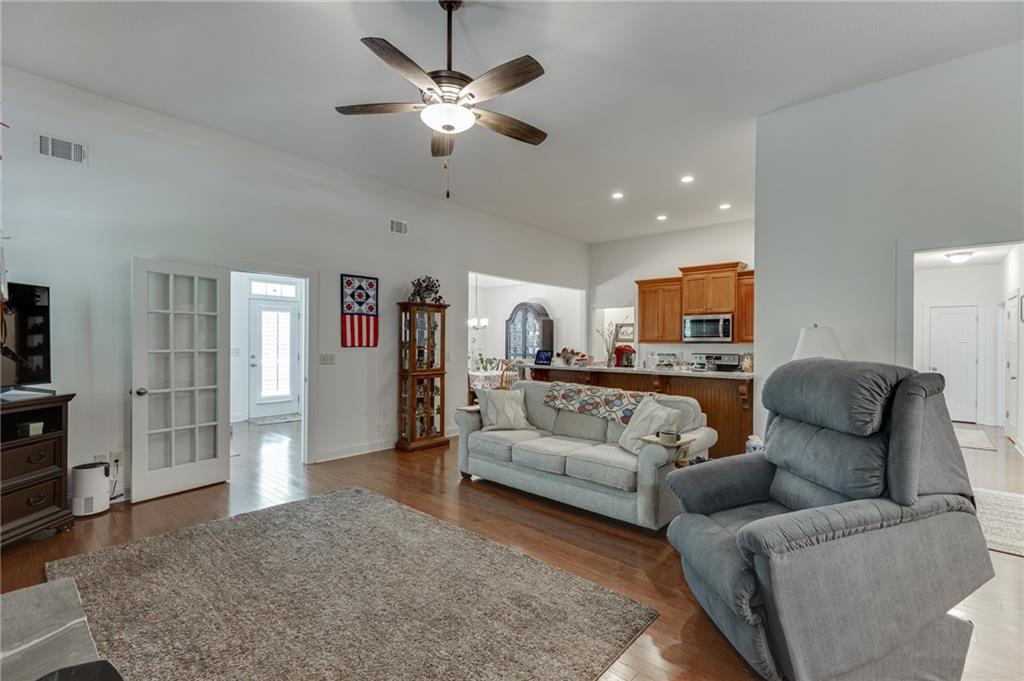7660 Fern Lane Lula, GA 30554 - Photo 9 of 50 a living room with furniture and a chandelier