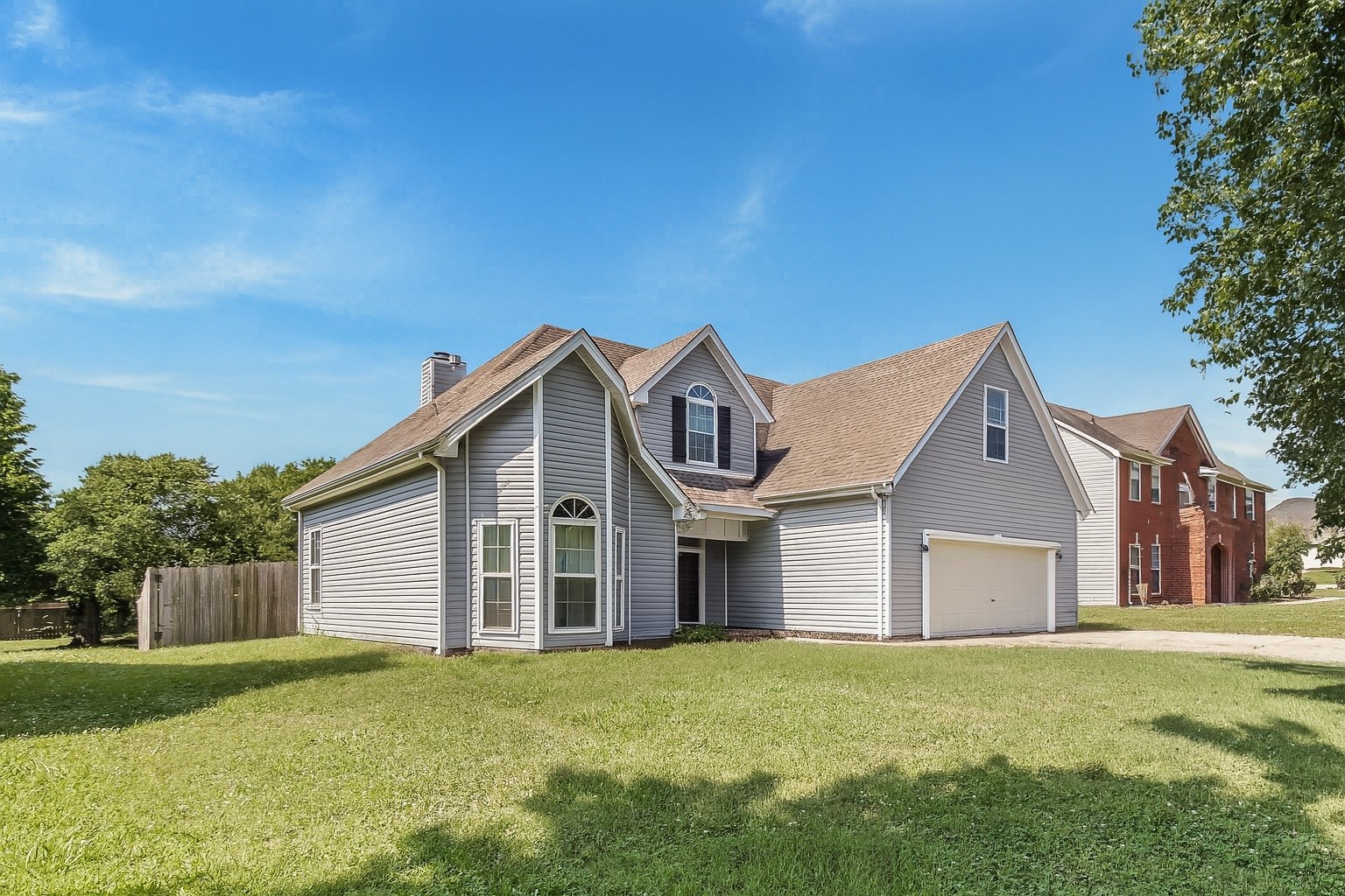 2117 Spring Hill Circle Spring Hill, TN 37174 - Photo 1 of 32 a front view of a house with garden