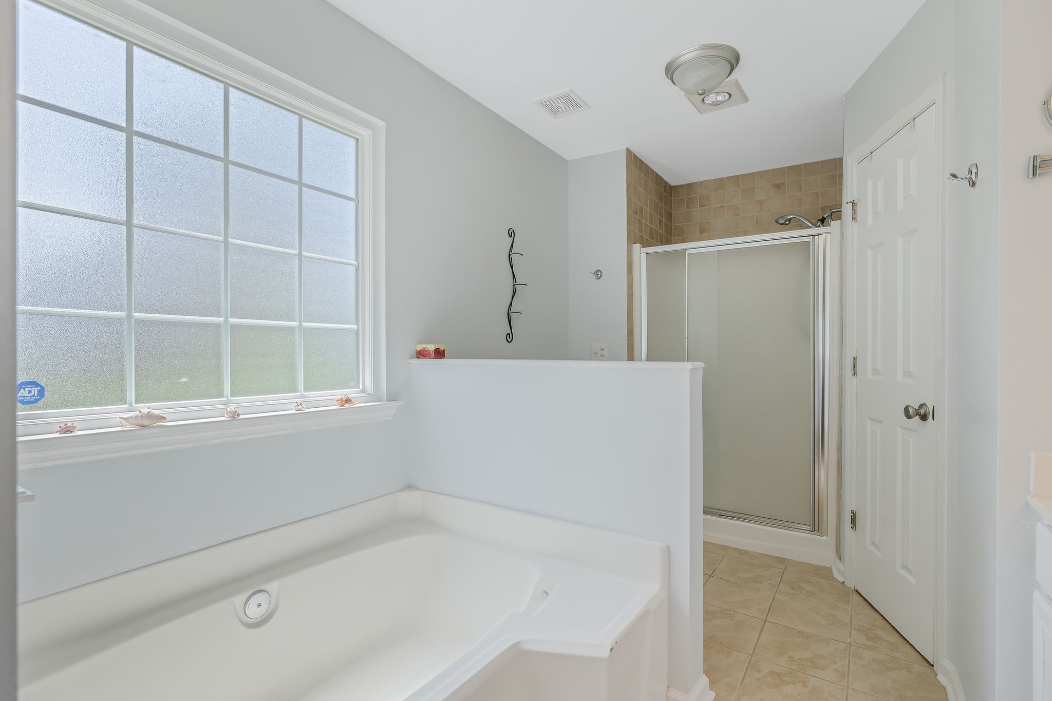 2117 Spring Hill Circle Spring Hill, TN 37174 - Photo 18 of 32 a bathroom with a bathtub and a window