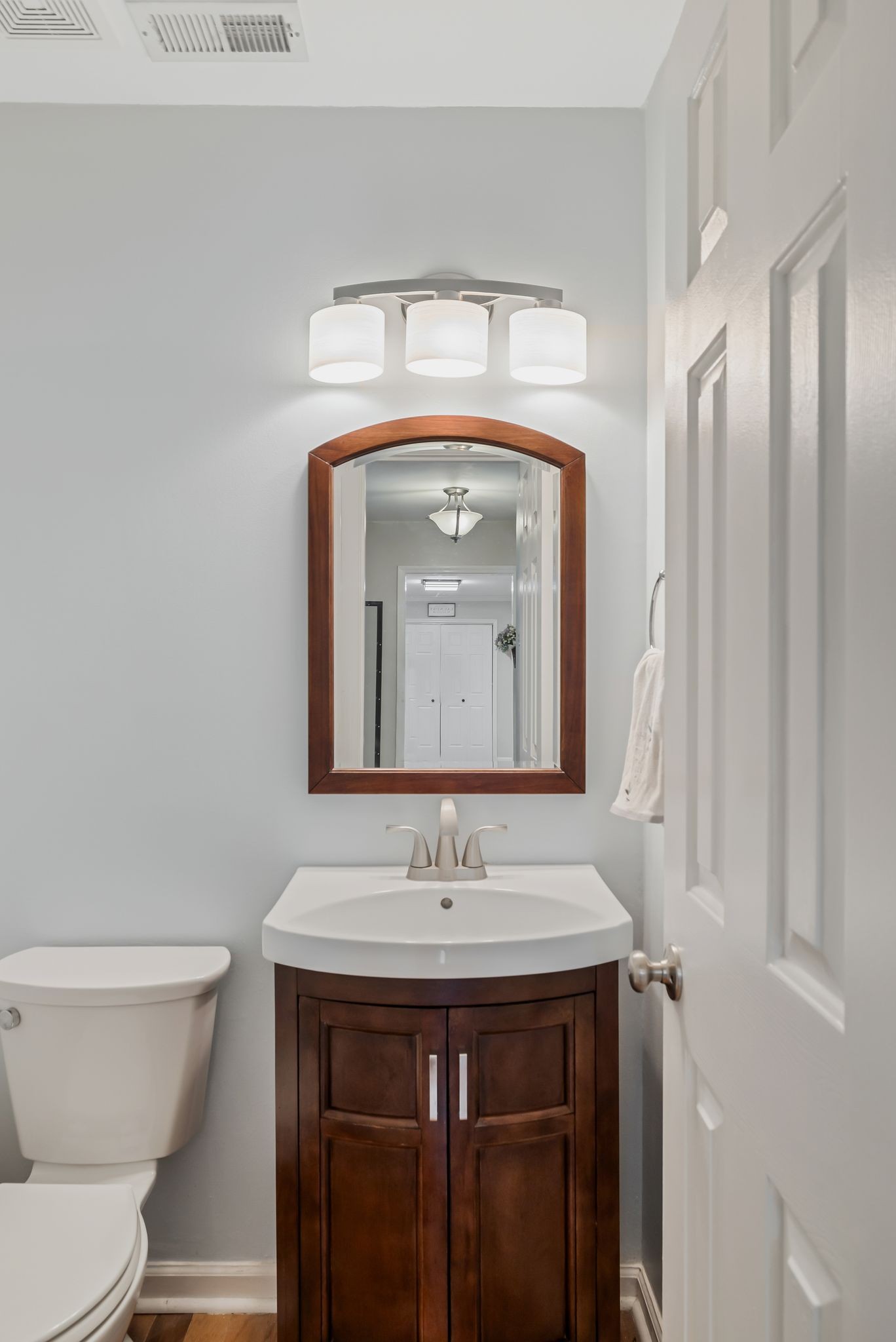 2117 Spring Hill Circle Spring Hill, TN 37174 - Photo 19 of 32 a bathroom with a toilet sink and mirror