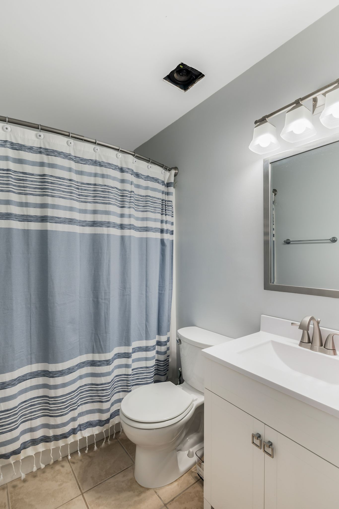 2117 Spring Hill Circle Spring Hill, TN 37174 - Photo 26 of 32 a bathroom with a sink a toilet and shower