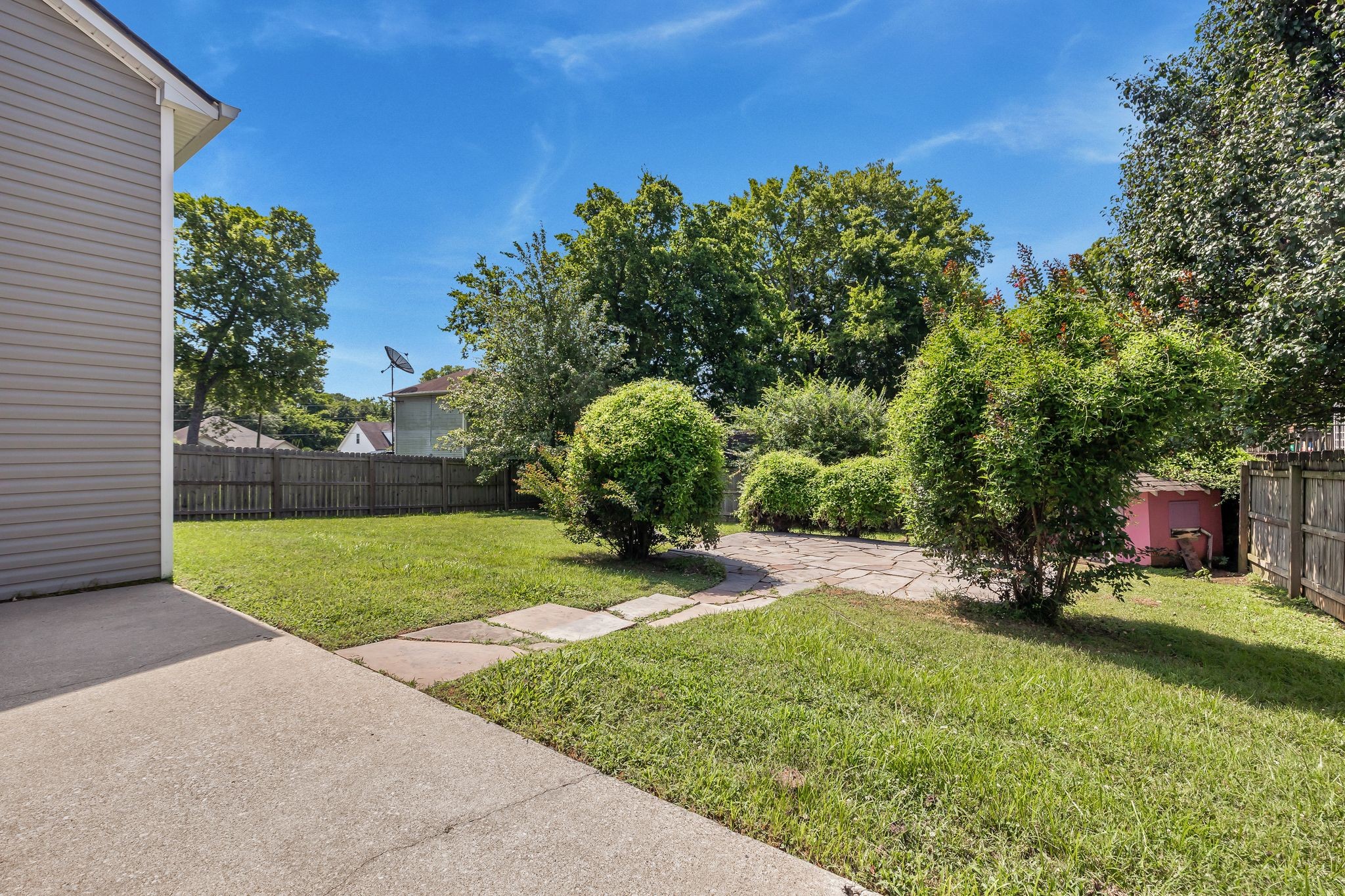 2117 Spring Hill Circle Spring Hill, TN 37174 - Photo 30 of 32 a view of a backyard with a garden and entertaining space