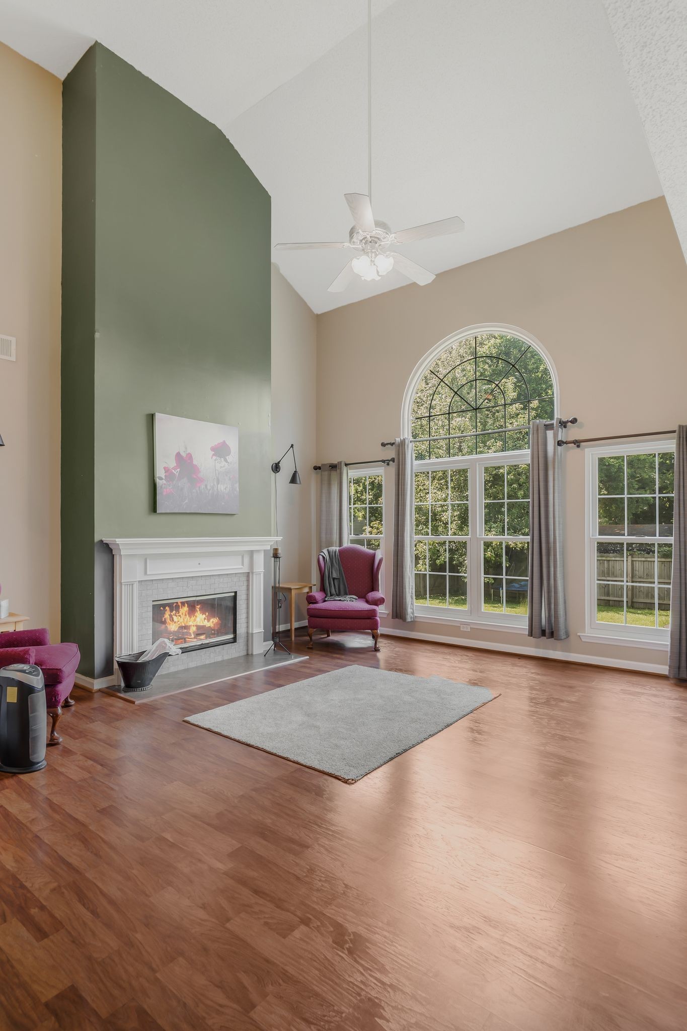 2117 Spring Hill Circle Spring Hill, TN 37174 - Photo 6 of 32 a view of an empty room with a fireplace and a large window