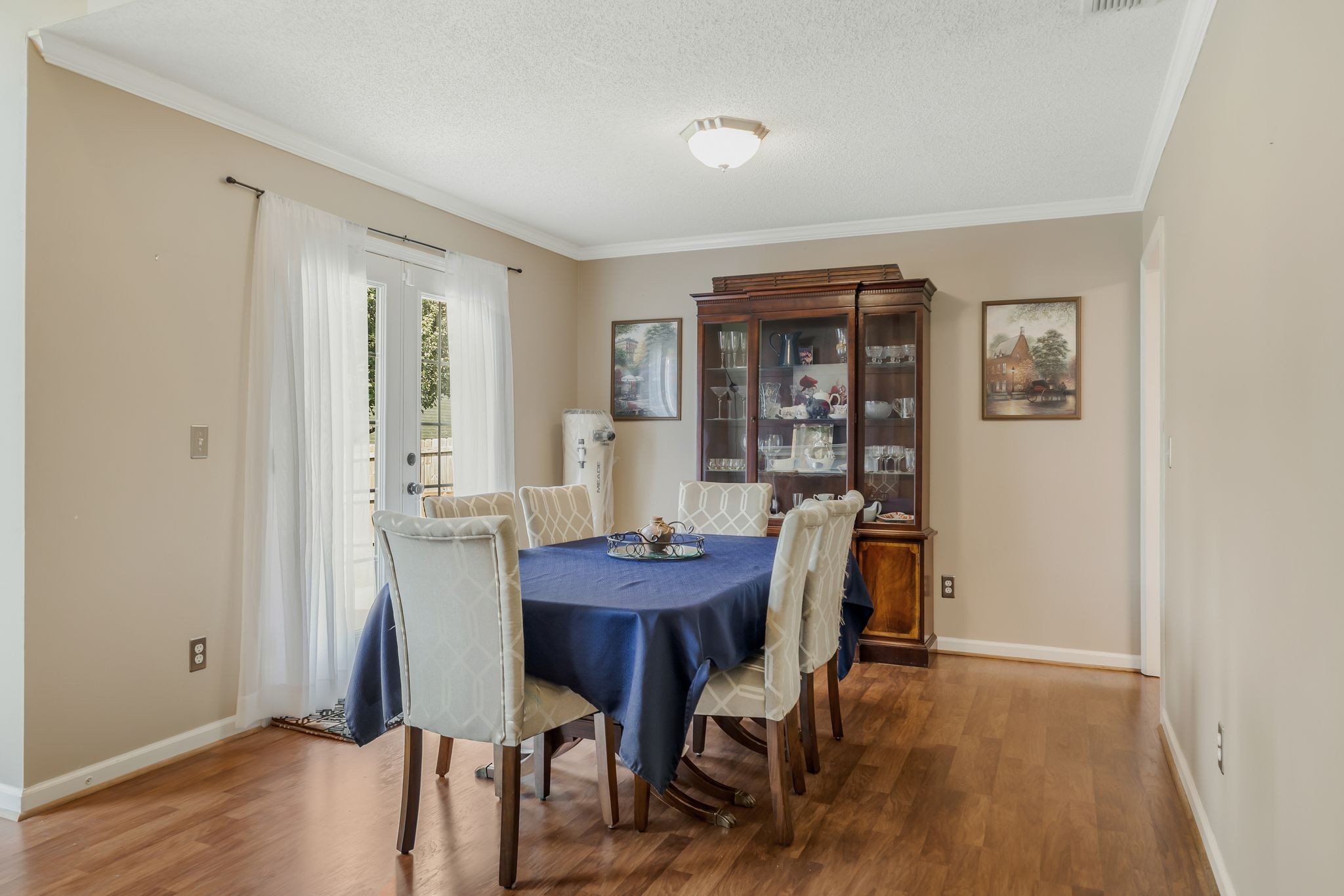 2117 Spring Hill Circle Spring Hill, TN 37174 - Photo 8 of 32 a view of a dining room with furniture and wooden floor