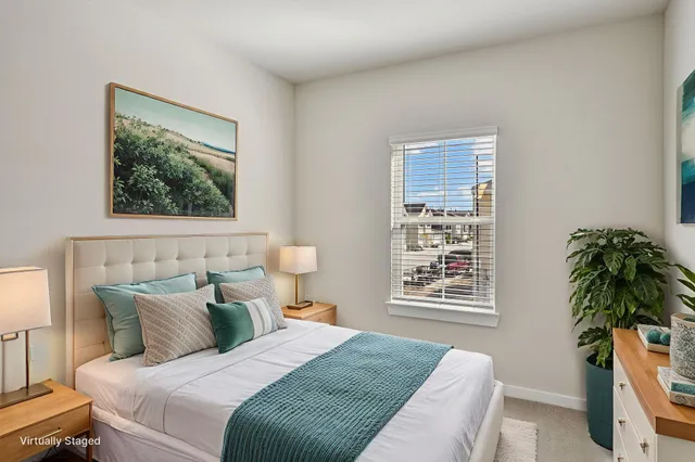 a bedroom with furniture and a window