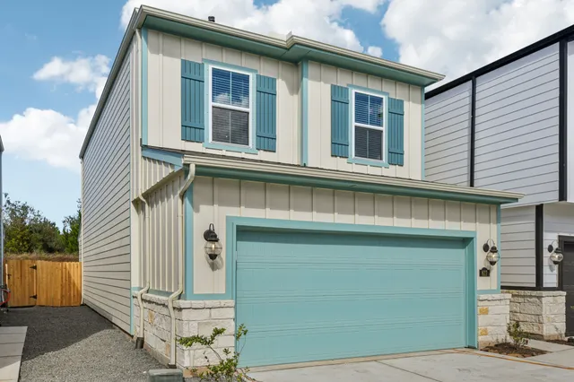 a front view of a house with a garage