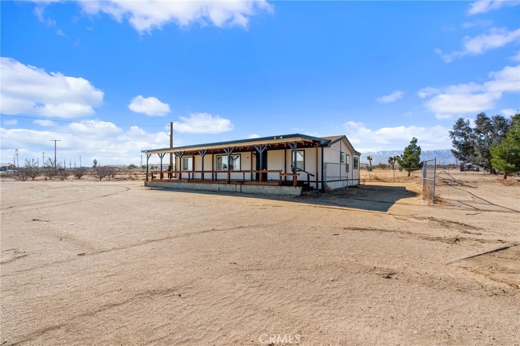 11524 Paramount Road Phelan, CA 92371 - Photo 4 of 34 a view of a house with a wooden deck