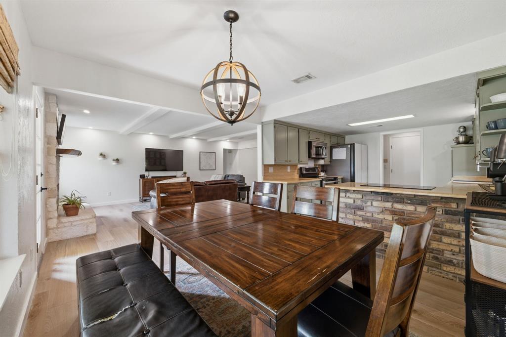 224 Overcrest Drive Benbrook, TX 76126 - Photo 12 of 39 a view of a dining room with furniture window and wooden floor