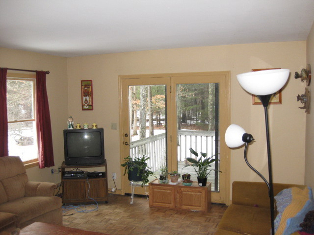 673 Polikoff Road Sheffield, MA 01222 - Photo 2 of 5 a living room with furniture and a flat screen tv