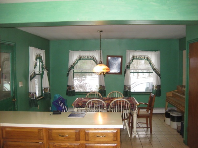673 Polikoff Road Sheffield, MA 01222 - Photo 4 of 5 a living room with furniture and a mirror