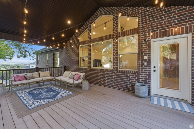 441 South 2080th Street East Springville, UT 84663 - Photo 43 of 64 Expansive outdoor deck featuring wood-finish flooring, a dark brown covered ceiling, and string lighting