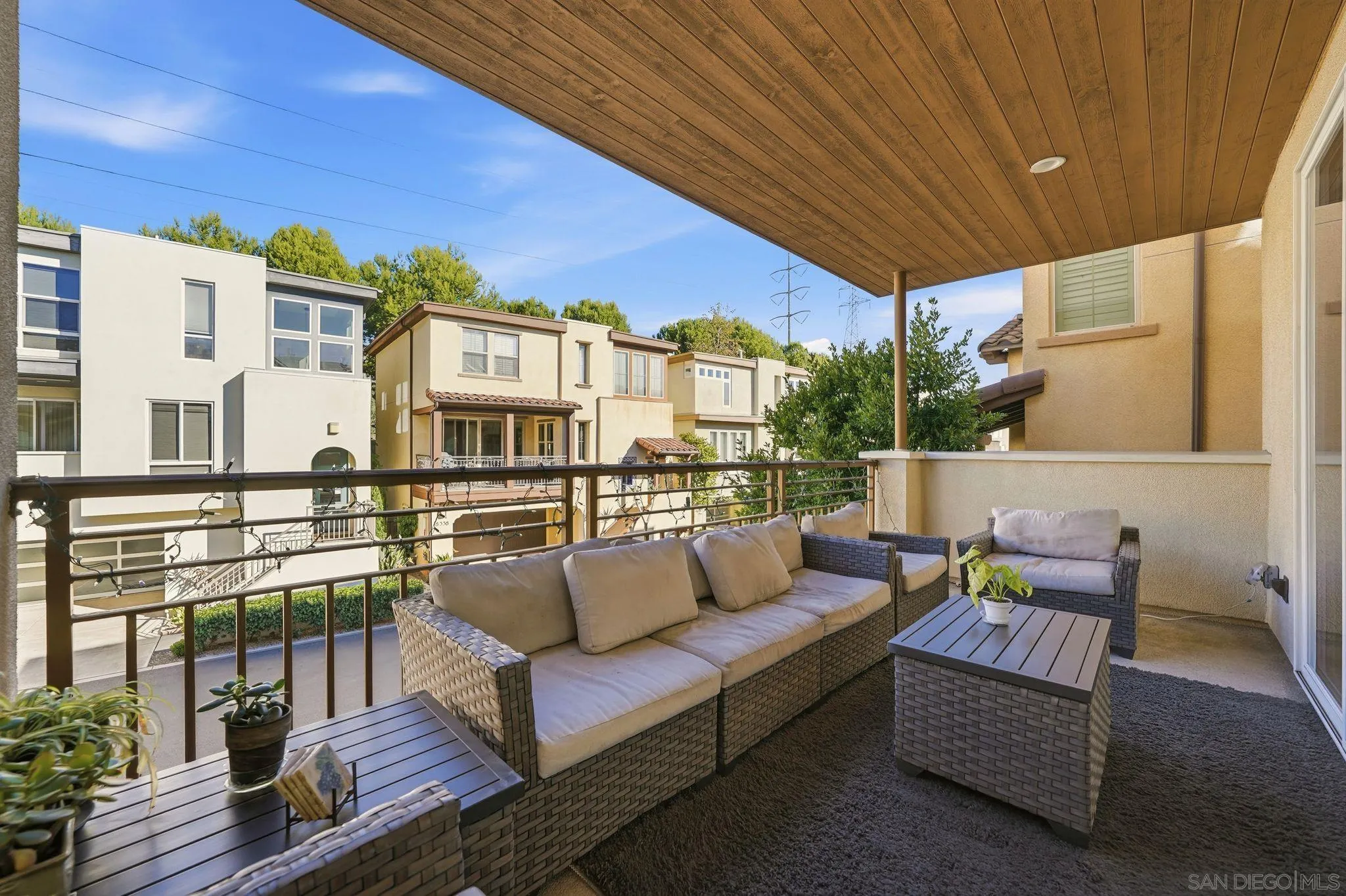 8337 Summit Way San Diego, CA 92108 - Photo 19 of 61 a roof deck with couch and wooden floor