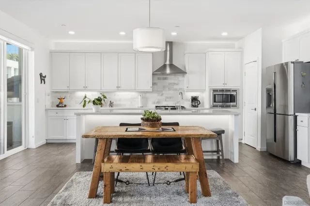 a kitchen with a sink cabinets and window